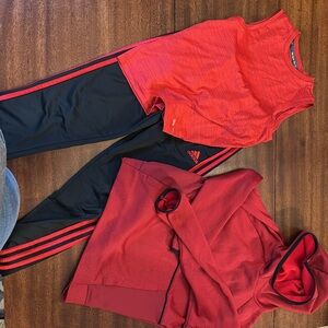3 piece boys black and red activewear.